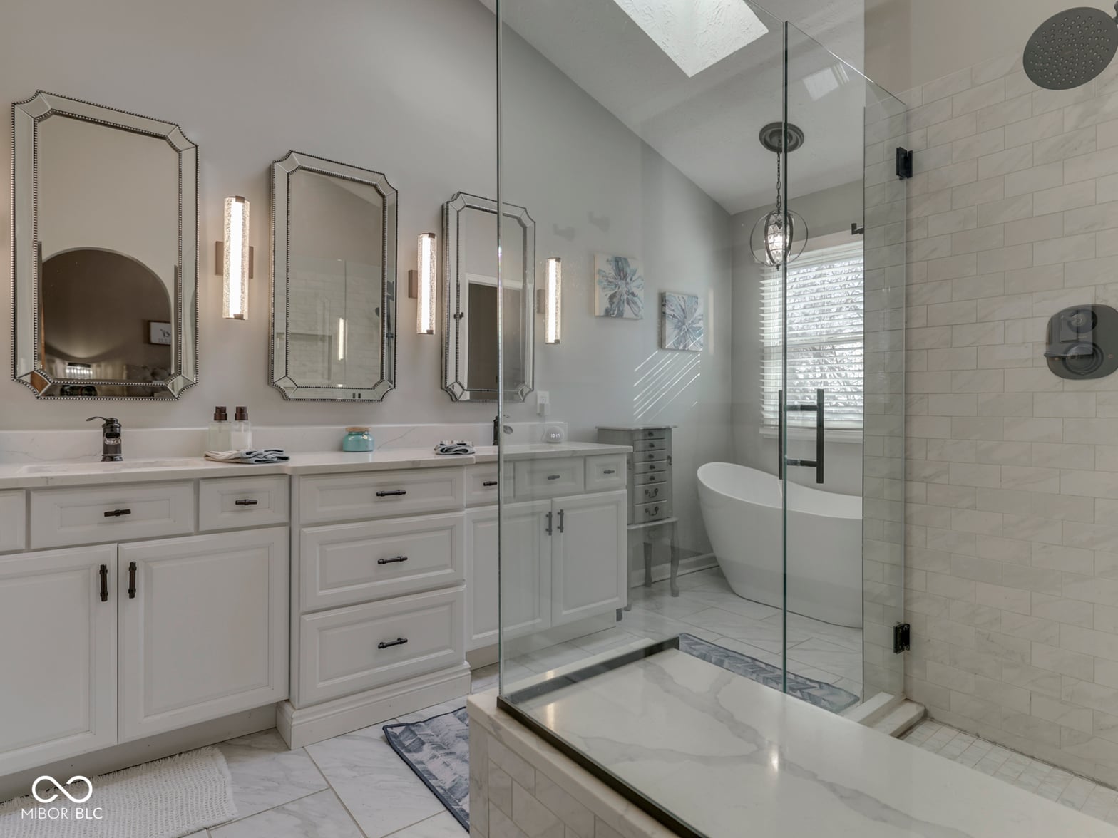 Luxurious spa-inspired primary bath with freestanding tub.