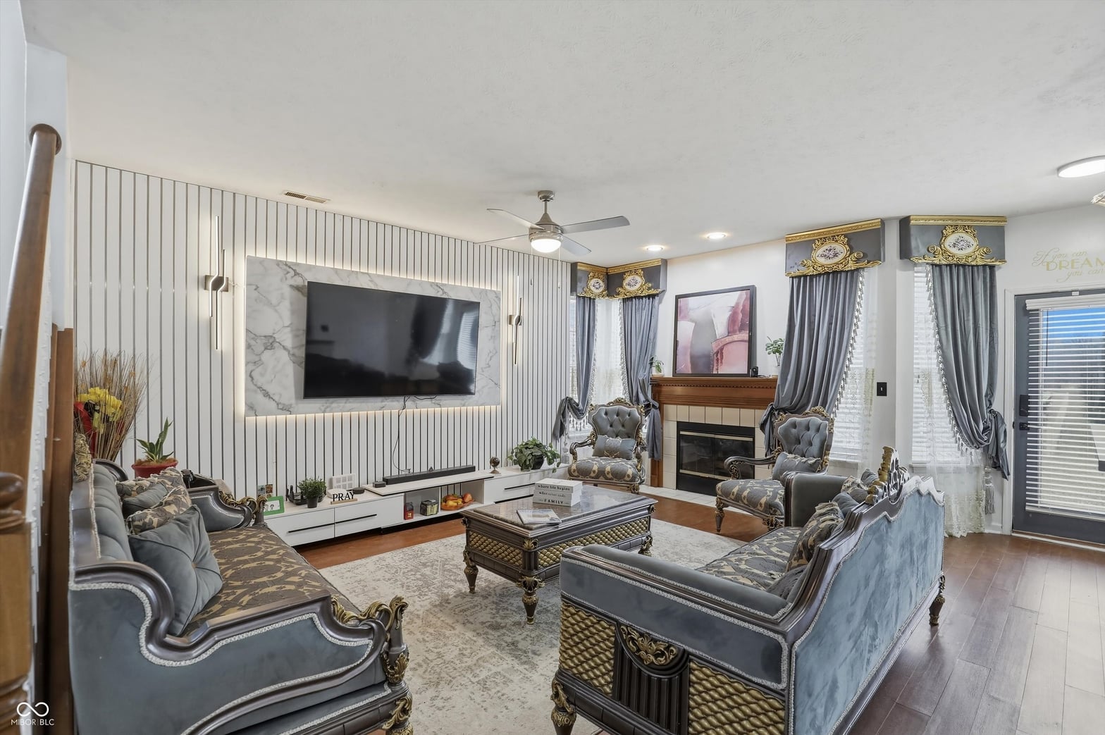 Elegantly appointed traditional living room with fireplace.