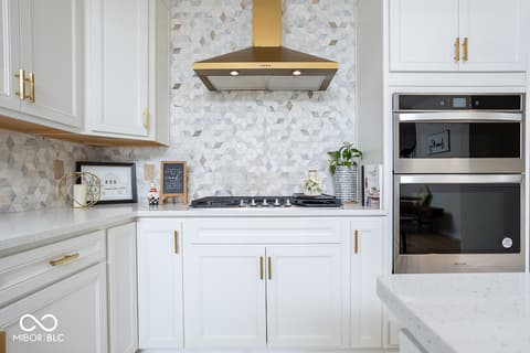 Kitchen at 5300 Veranda Drive, Noblesville, IN — Elegant kitchen with marble accents and modern appliances.
