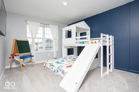 Bedroom at 5300 Veranda Drive, Noblesville, IN — Spacious child's bedroom with fun loft bed and slide.