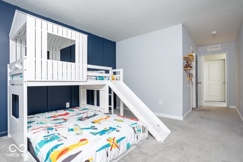 Bedroom at 5300 Veranda Drive, Noblesville, IN — Custom loft bed with slide and built-in storage.