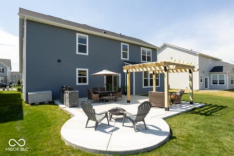 Backyard at 5300 Veranda Drive, Noblesville, IN — Beautiful backyard with patio, pergola, and fire pit.