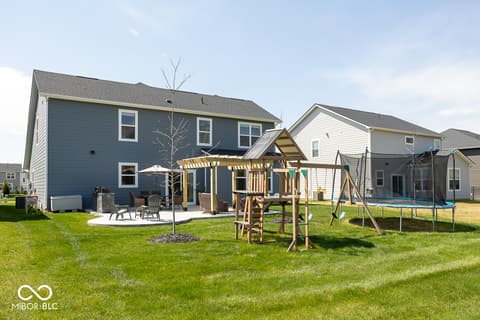 Backyard at 5300 Veranda Drive, Noblesville, IN — Spacious backyard with pergola, patio, and play areas.