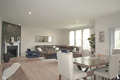 Living room at 5300 Veranda Drive, Noblesville, IN — Spacious open concept living with modern fireplace.
