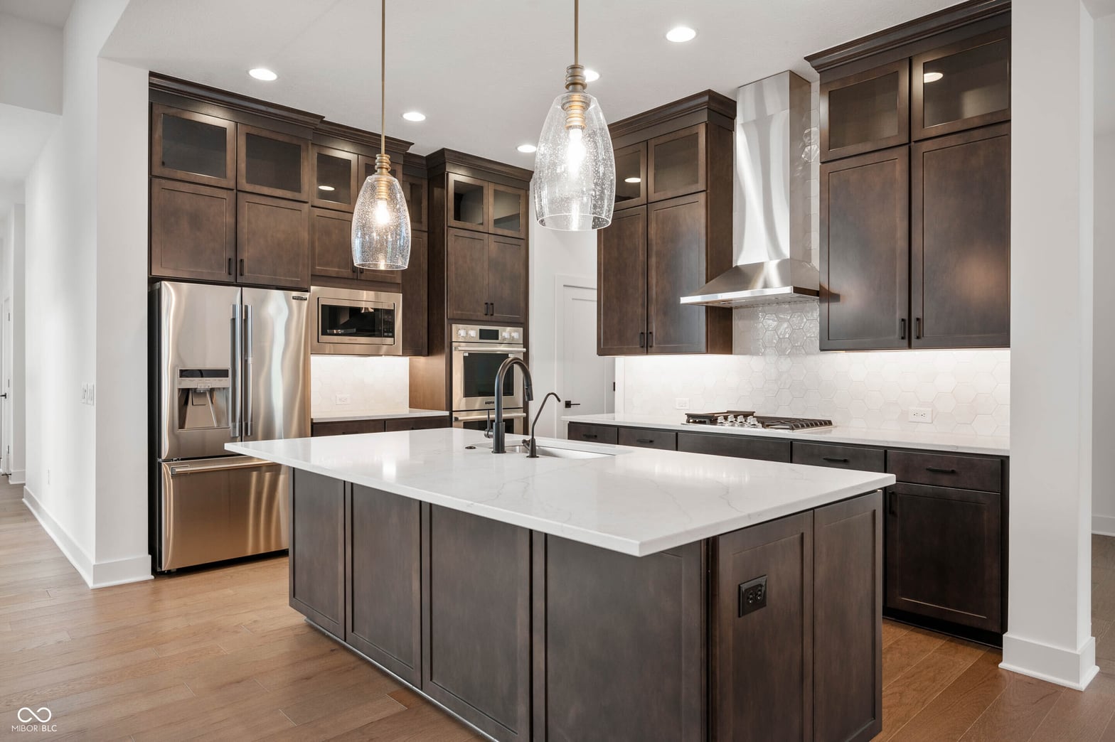 Chef's kitchen with island, premium appliances, and designer finishes.