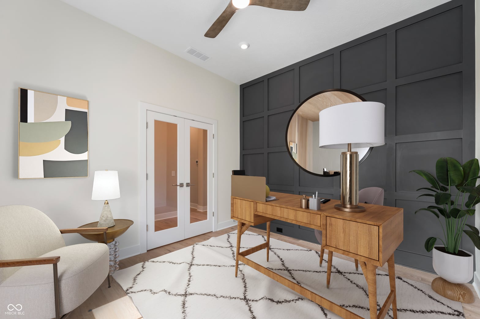 Spacious primary bedroom with modern desk nook and ensuite access.