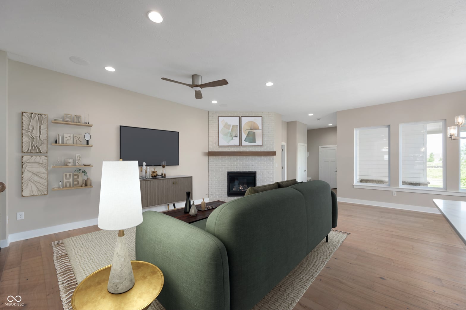 Bright family room with fireplace and abundant natural light.