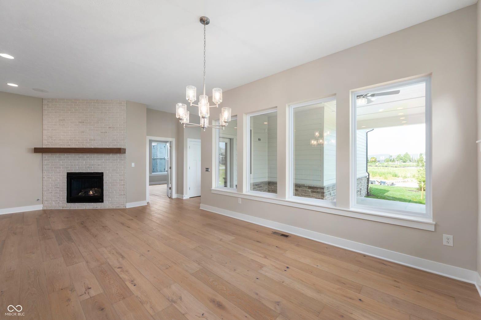 Bright, open living space with fireplace and abundant natural light.