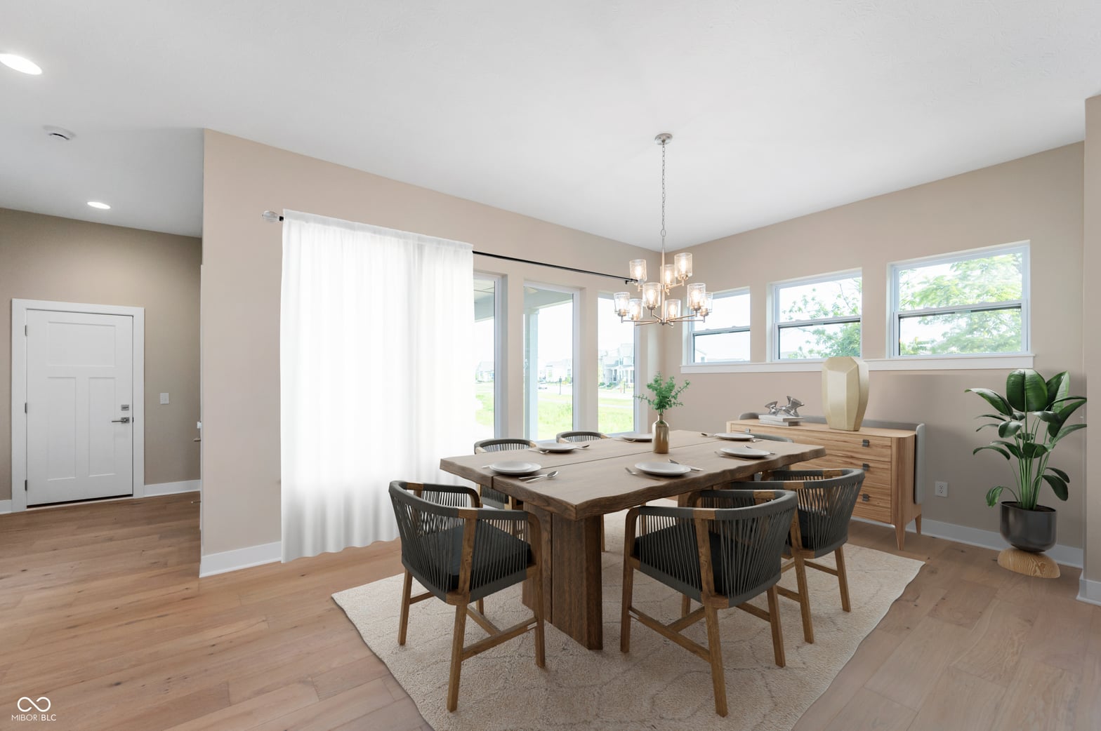 Bright contemporary dining with abundant natural light and patio access.