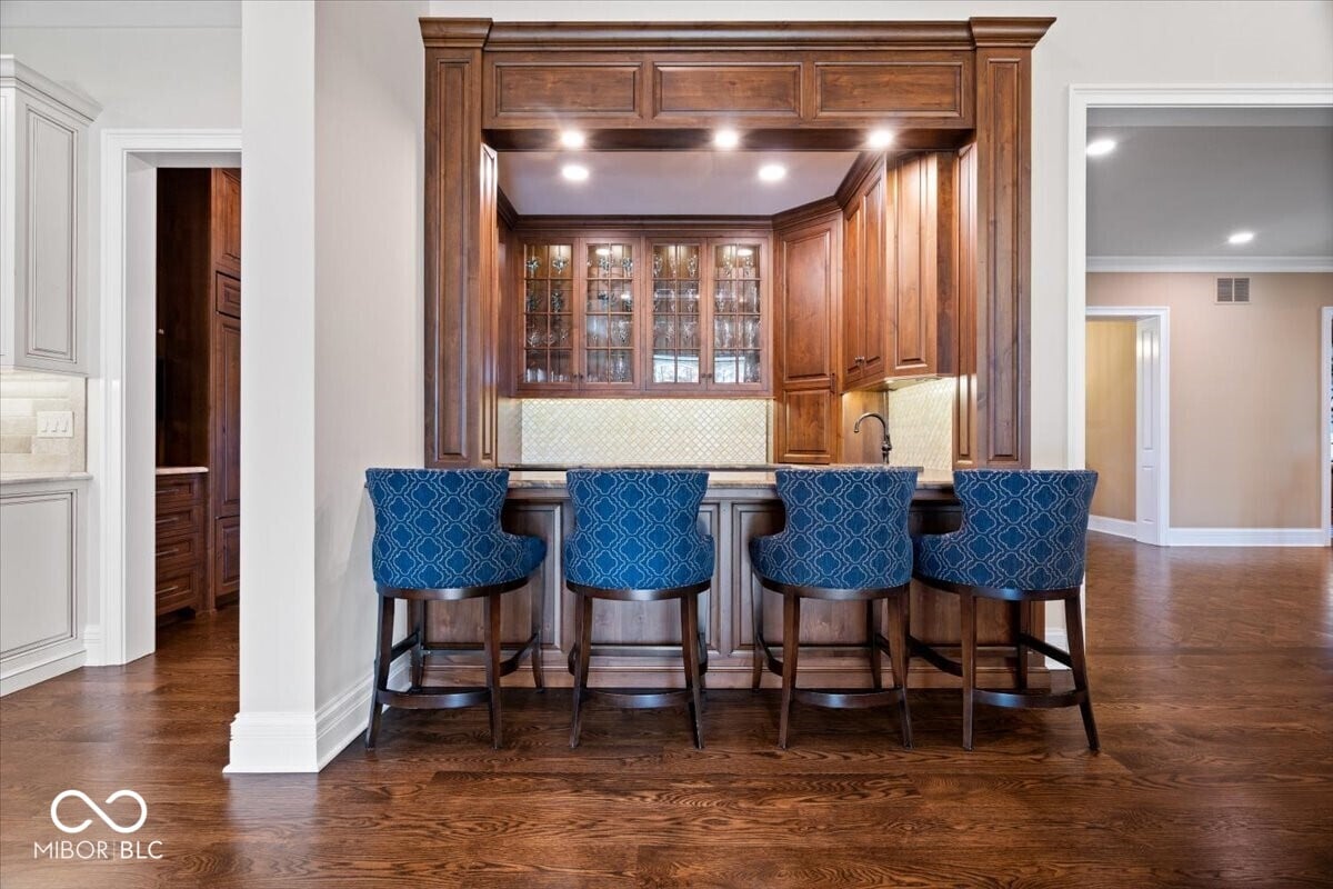 Elegant kitchen island with custom wood cabinetry and seating.