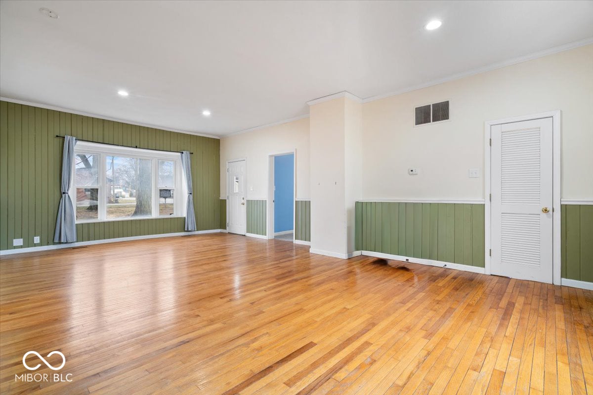 Bright renovated living space with original hardwood floors.