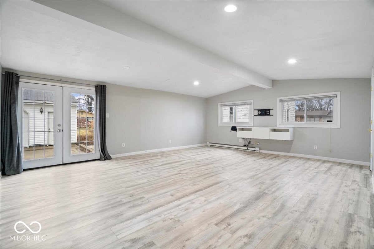 Bright open family room with patio access and built-ins.