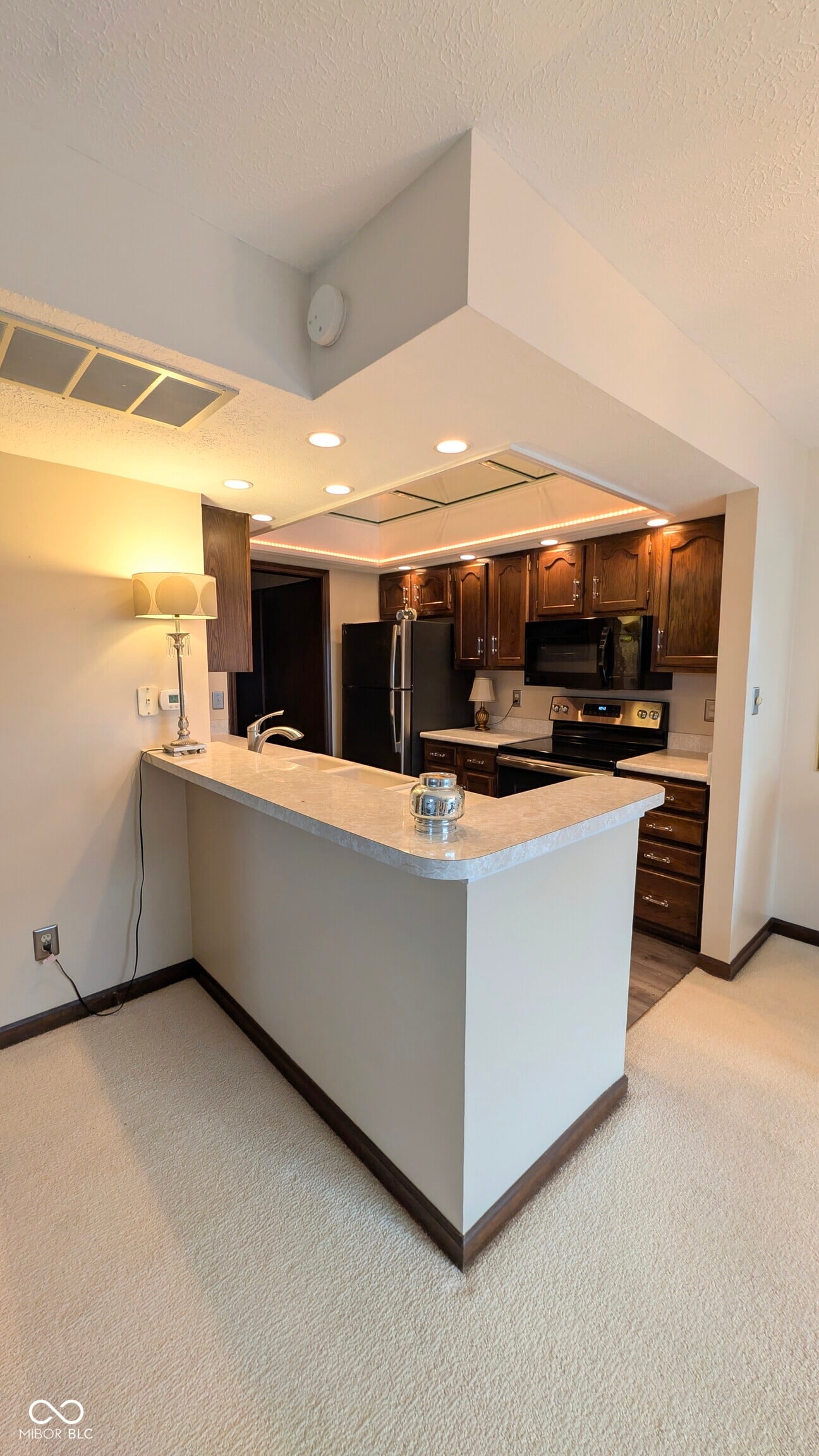 Modern renovated kitchen with island and premium finishes.