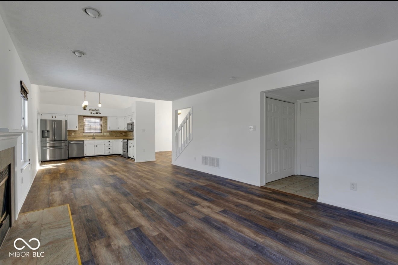 Bright renovated kitchen with stainless steel appliances.