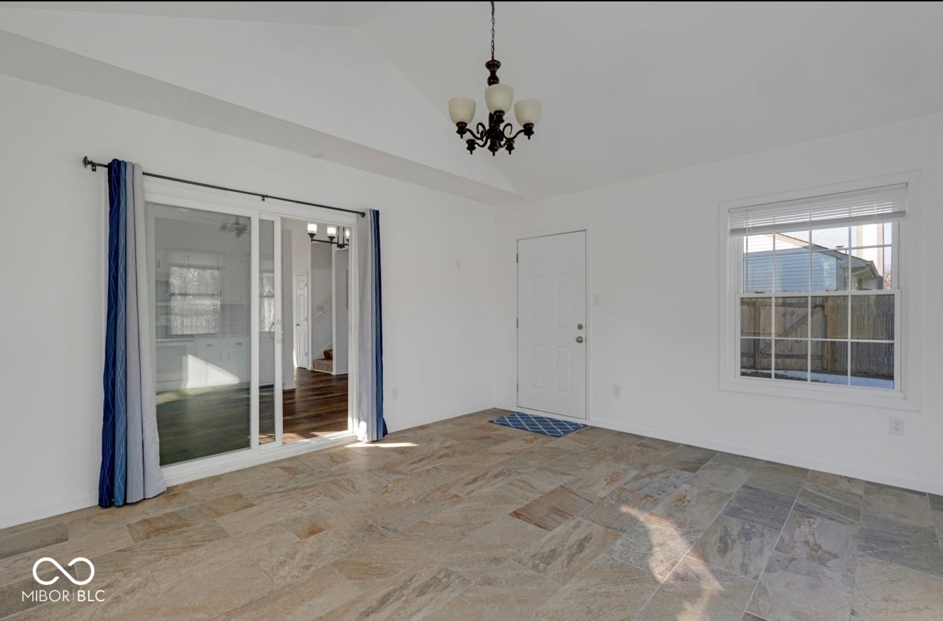 Bright primary suite with patio access and natural light.