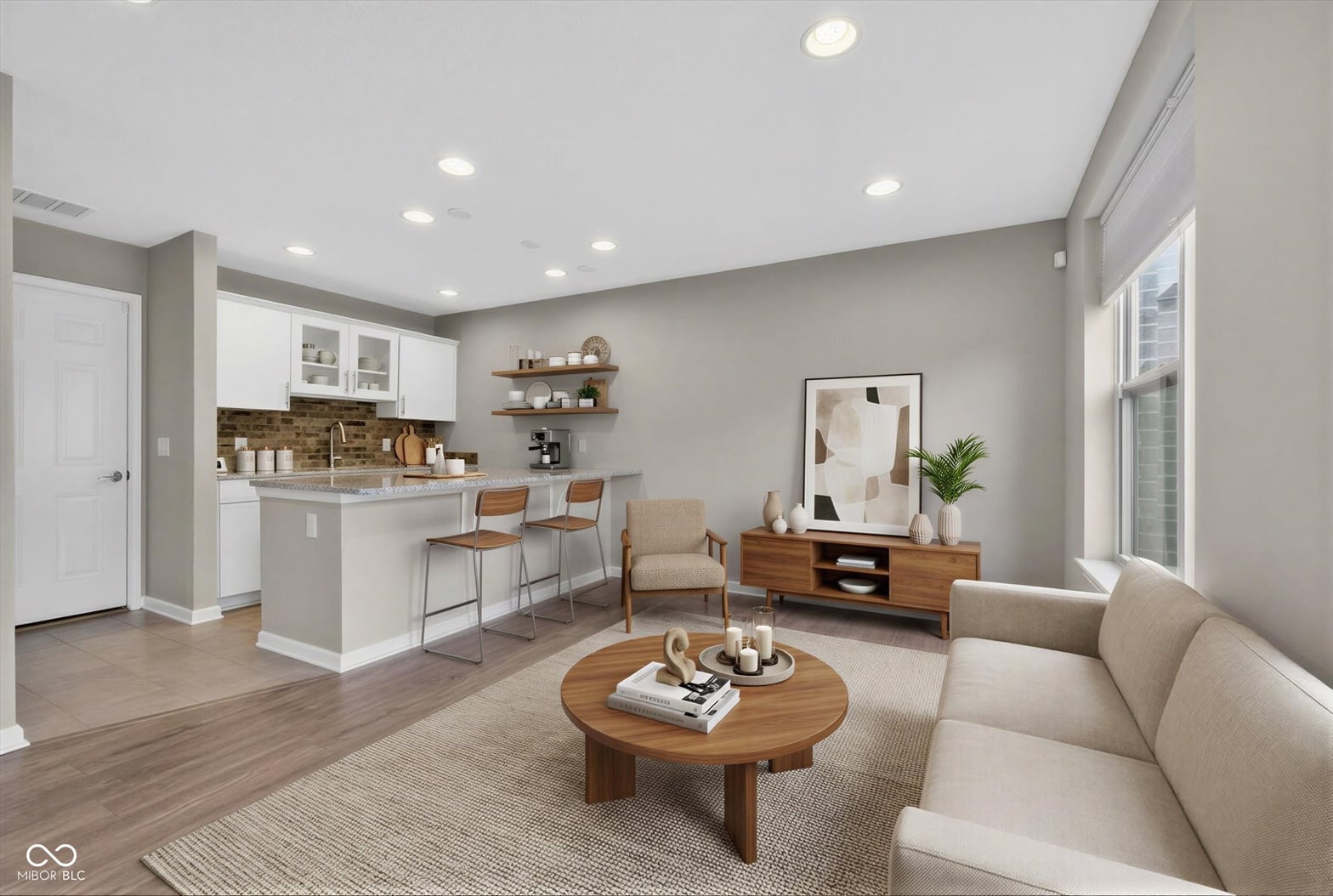 Bright, open-concept living area with updated kitchen.
