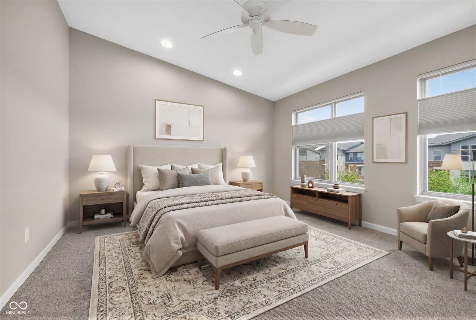 Bright primary suite with abundant windows and modern finishes.