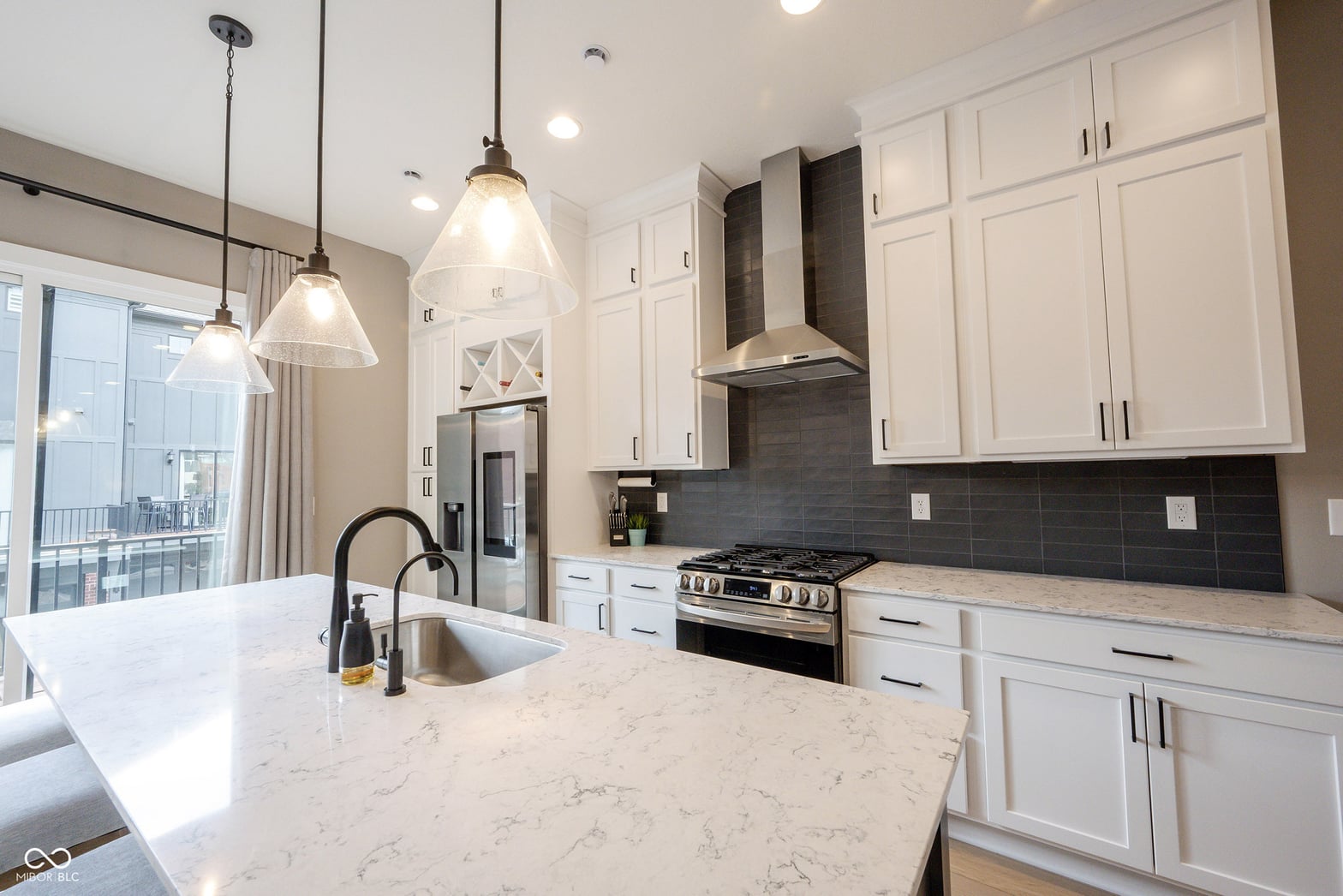 Luxurious updated kitchen with premium finishes and island.
