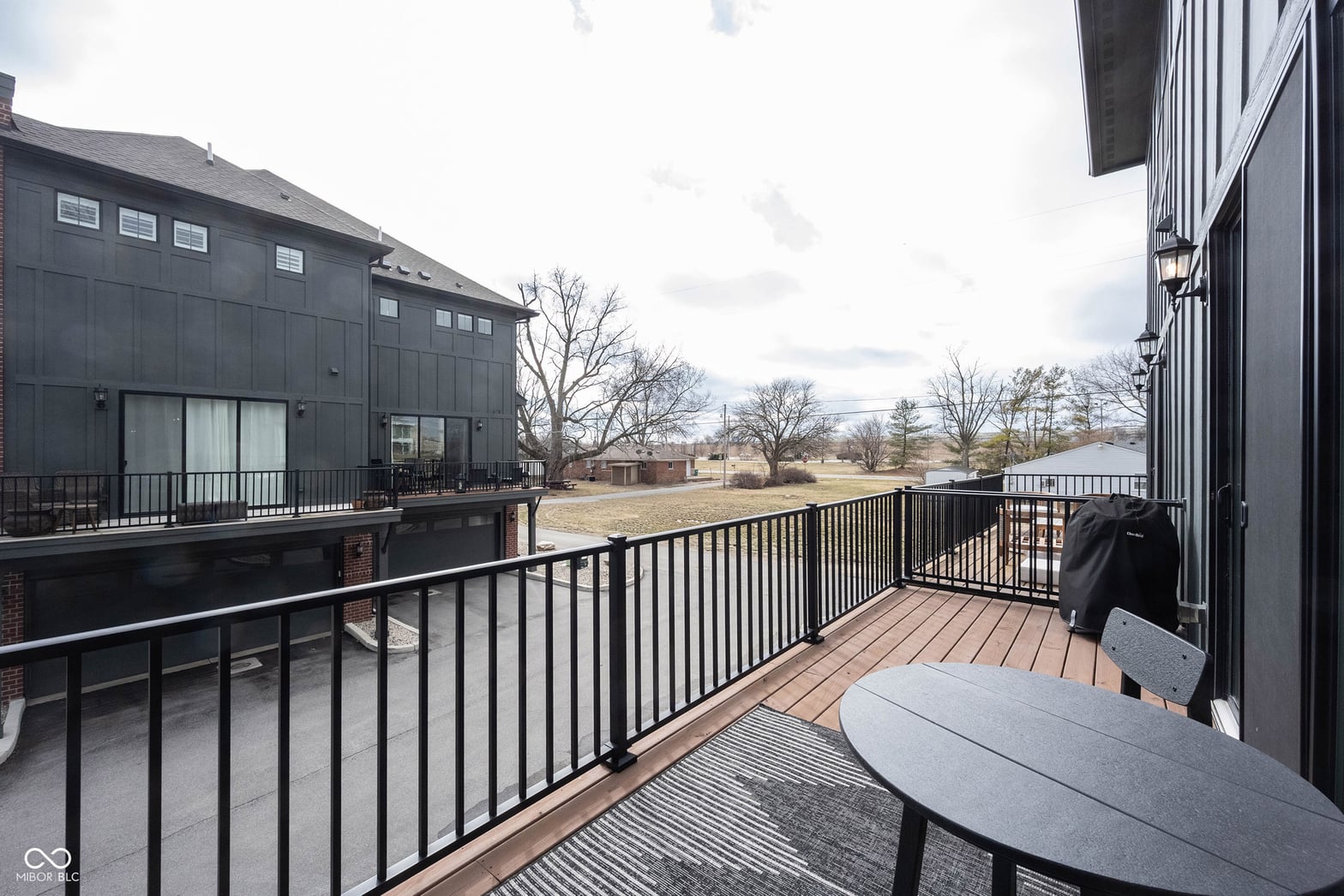 Modern elevated deck with expansive yard views.
