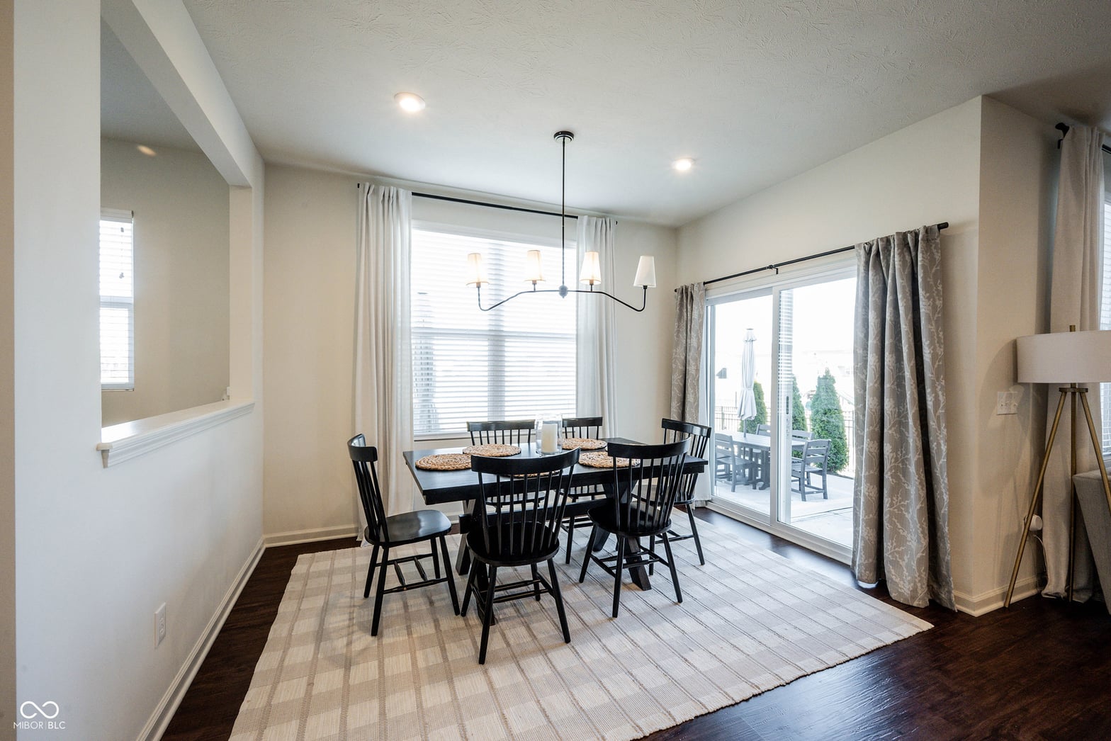 Bright dining area with patio access and modern finishes.