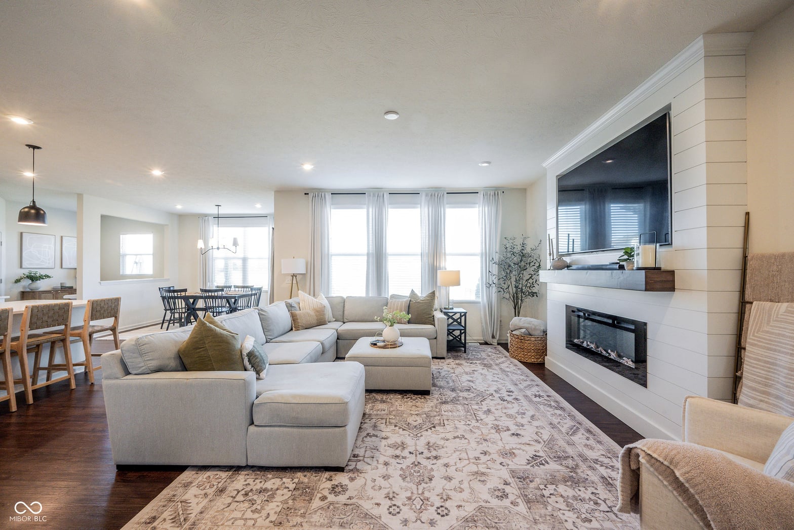 Bright, open living space with fireplace and modern amenities.