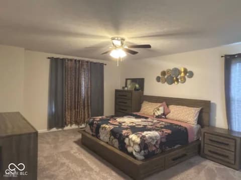 Primary bedroom at 15306 Dawn Run Drive, Fishers, IN — Spacious primary bedroom with plenty of natural light.