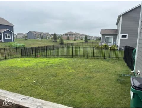 Yard at 15306 Dawn Run Drive, Fishers, IN — Spacious fenced yard perfect for families and pets.