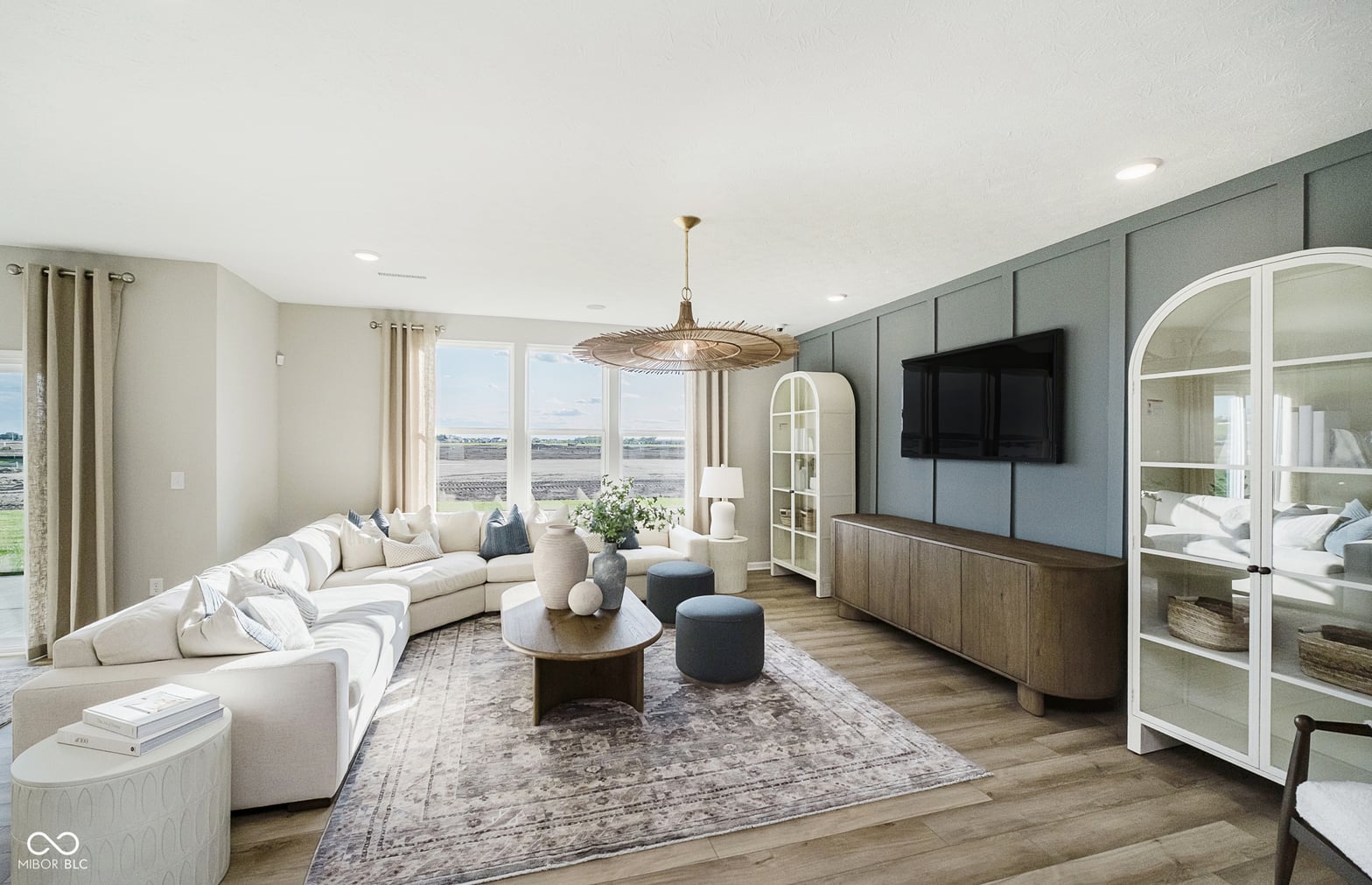 Spacious modern living room with panoramic views and designer finishes.