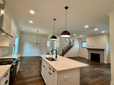 Kitchen at 9867 Bucklebury Lane, Carmel, IN — Bright modern kitchen with island and open living space.
