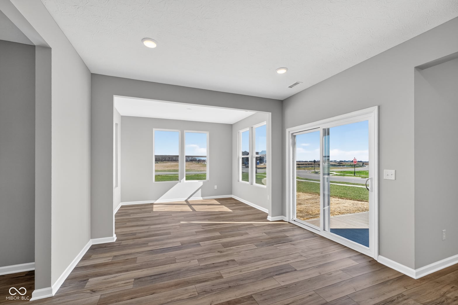 Bright open space with expansive windows and countryside views.