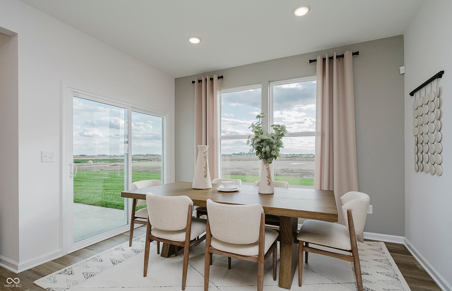 Bright dining room with expansive rural views and modern finishes.