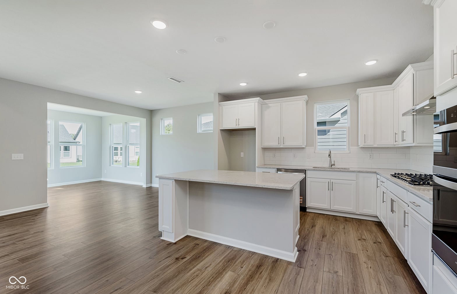 Bright modern kitchen with island and premium appliances.