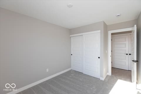 Primary bedroom at 438 Elite Street, Westfield, IN — Spacious primary bedroom with large closet space.