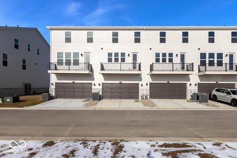Front exterior at 438 Elite Street, Westfield, IN — Brand new townhome community with modern attached garages.