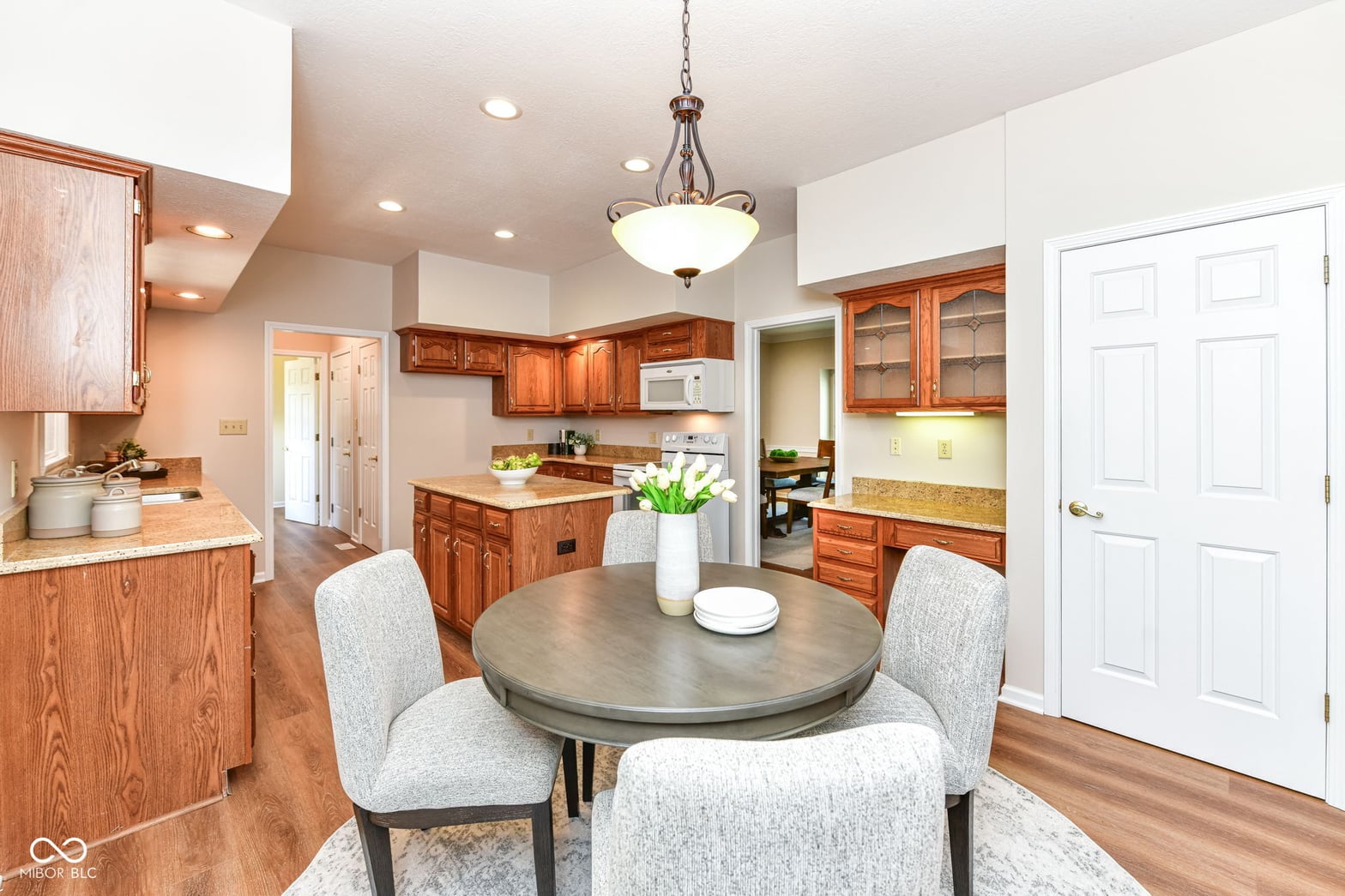 Updated kitchen with island and open dining area.