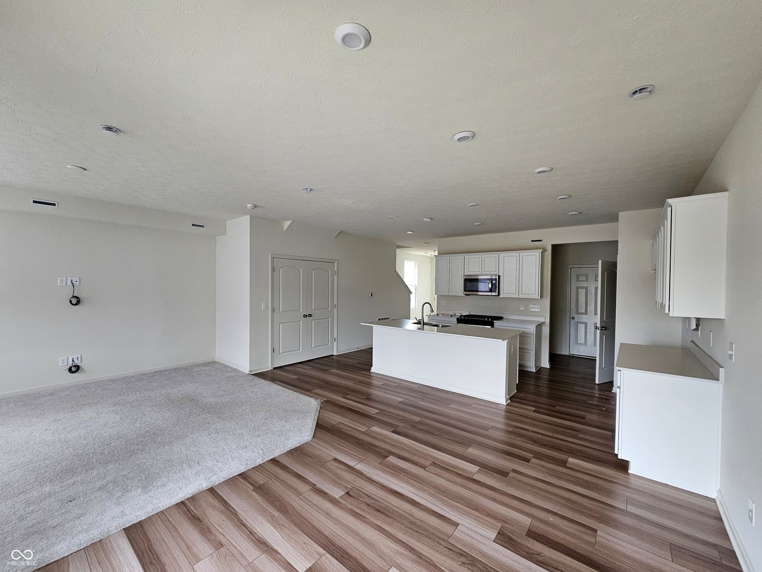 Bright open-concept living space with modern kitchen island.