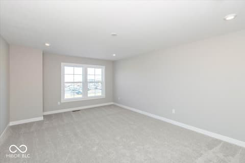 Bedroom at 436 Elite Street, Westfield, IN — Bright bedroom with expansive windows and panoramic views.