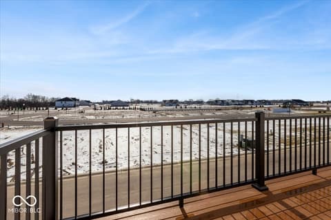 Backyard at 436 Elite Street, Westfield, IN — Waterfront deck with panoramic beach and lake views.