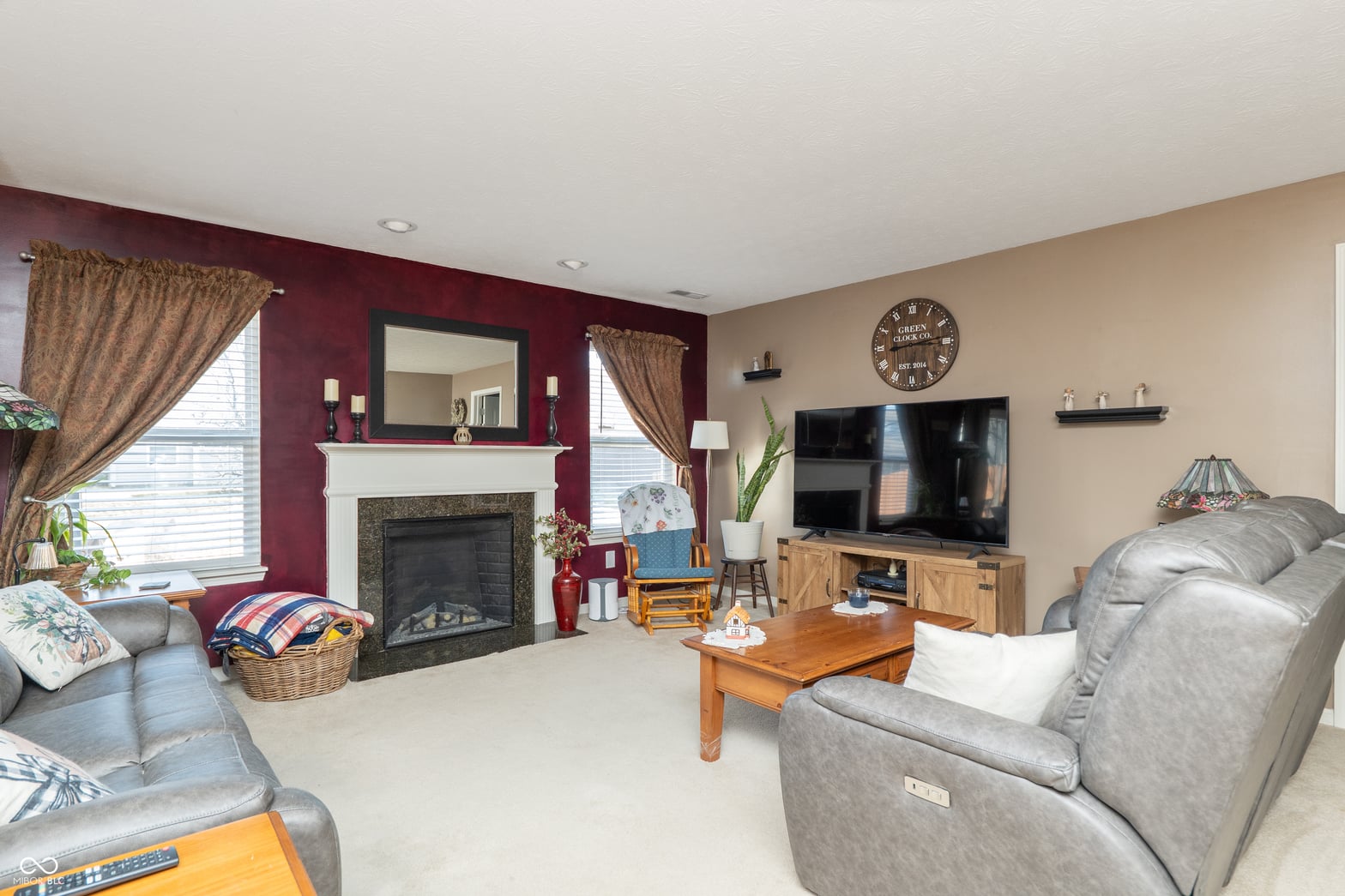Spacious family room with fireplace and abundant natural light.