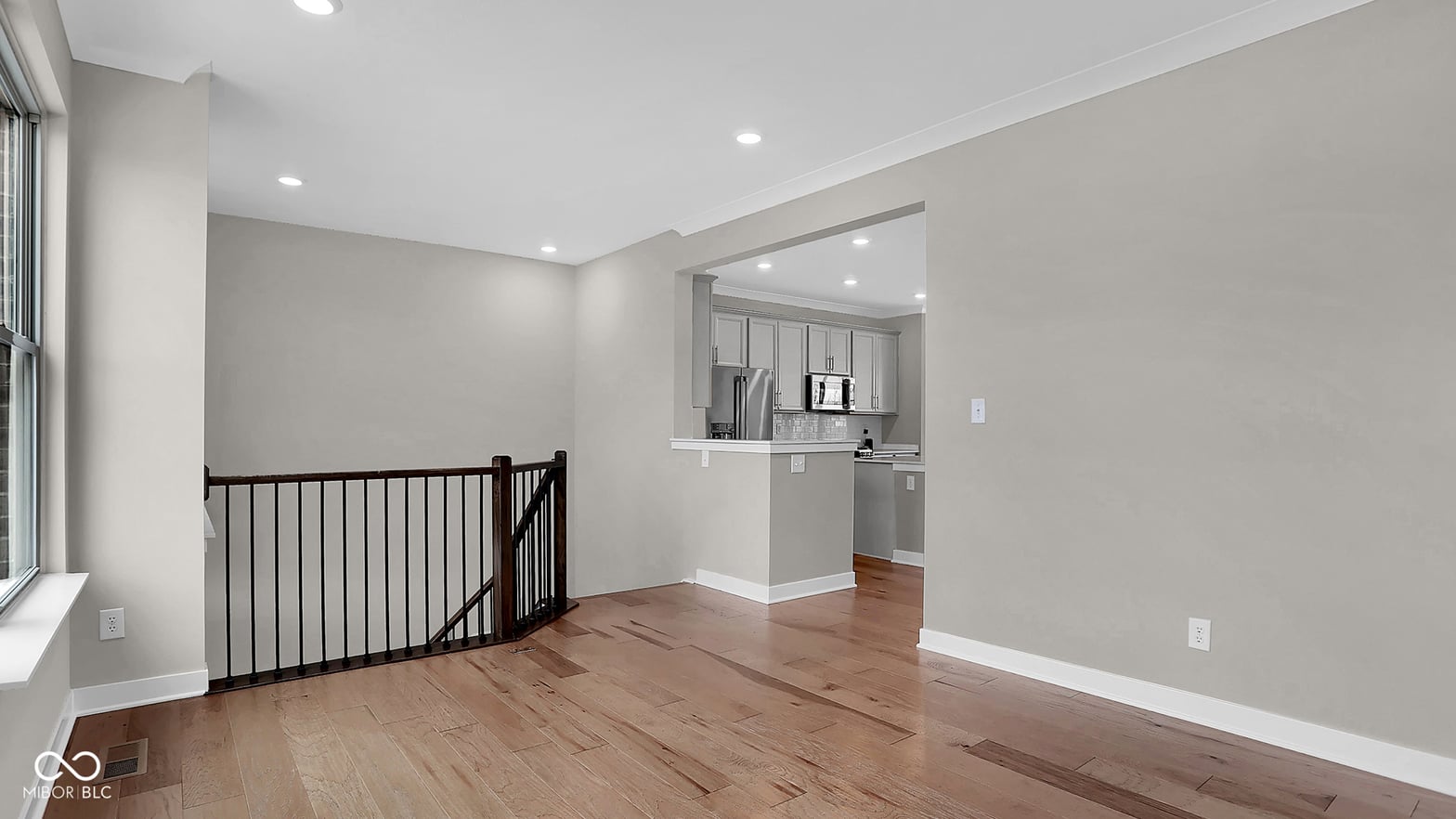 Bright, open family room with pass-through kitchen.