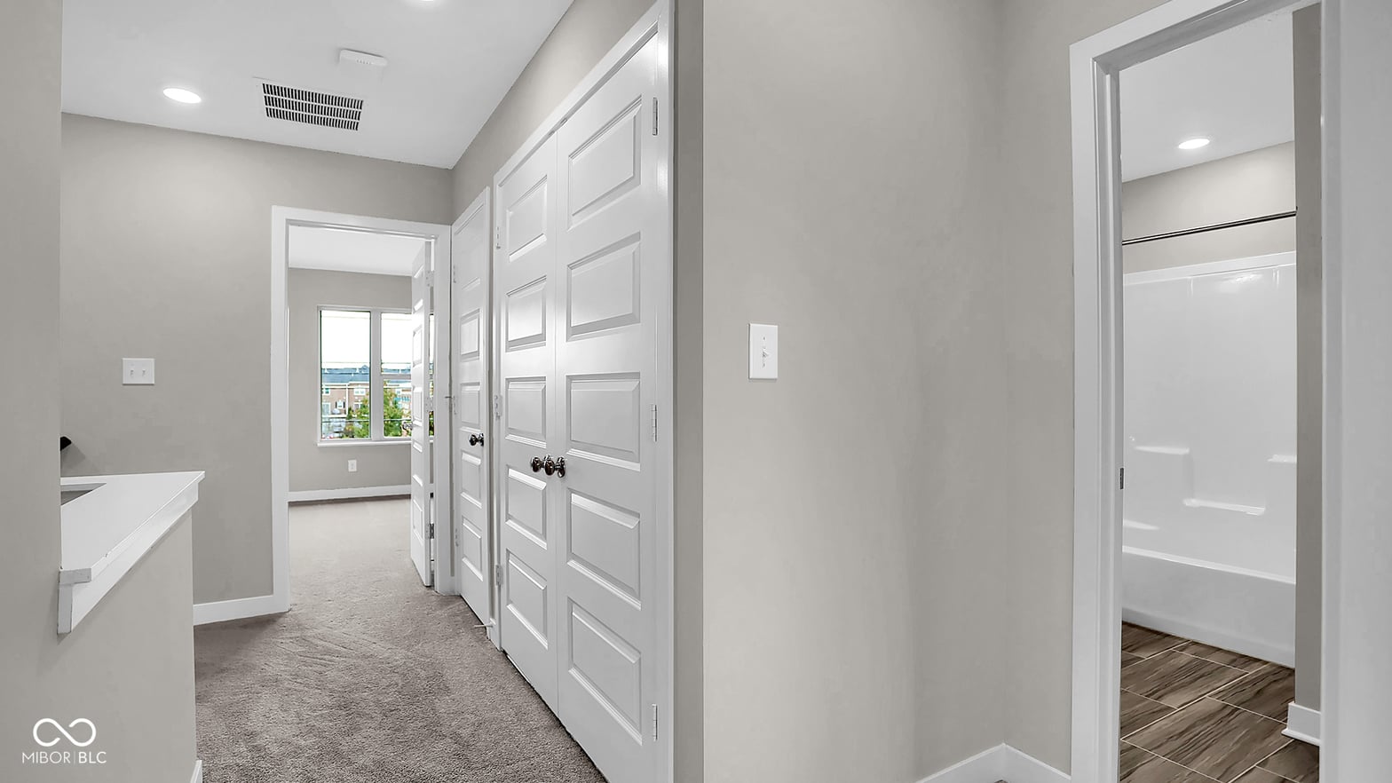 Spacious primary suite with dual closets and ensuite access.