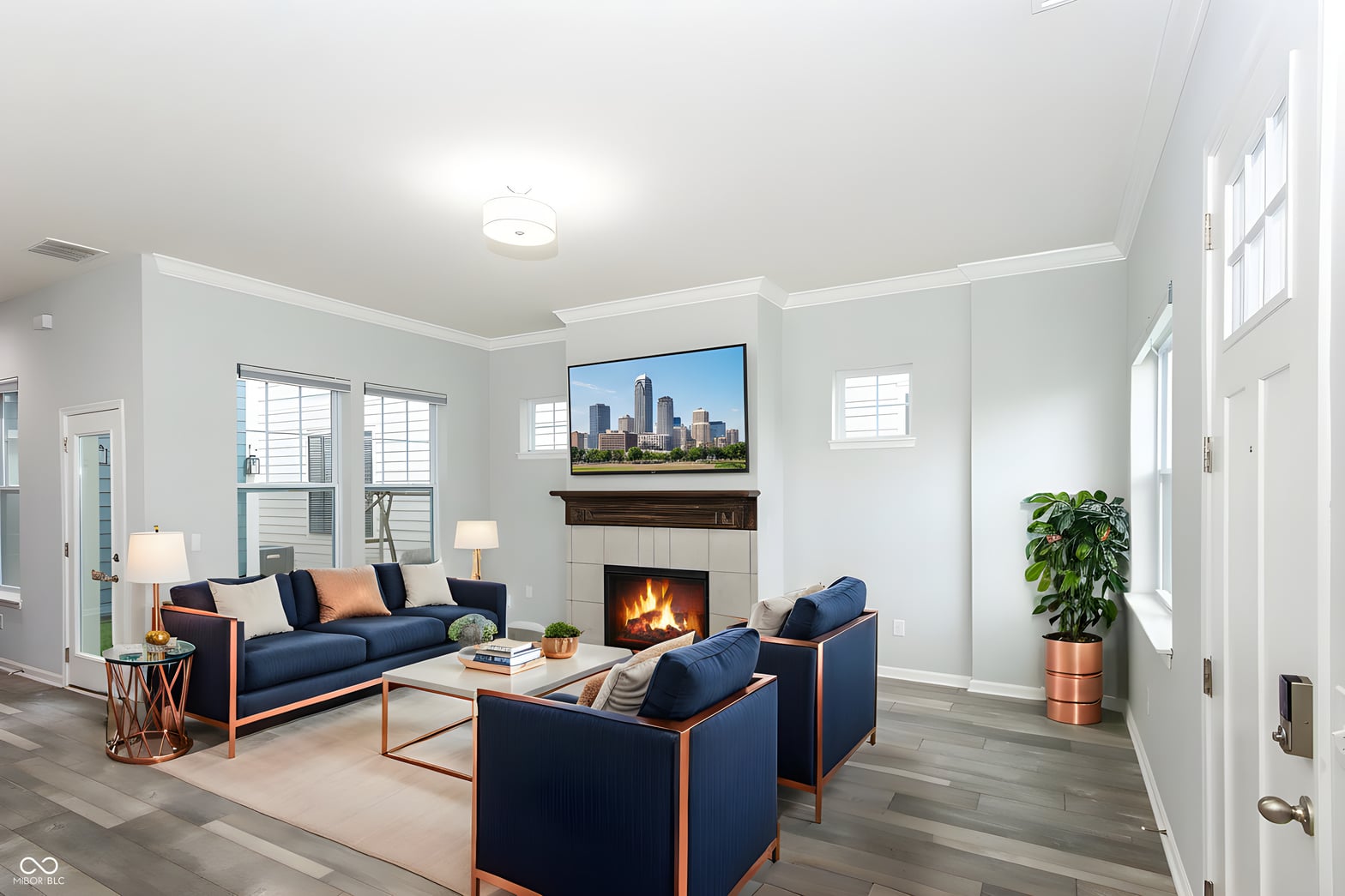 Bright living room with fireplace and modern finishes throughout.