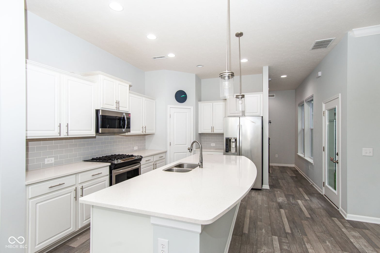 Bright modern kitchen with large island and premium finishes.