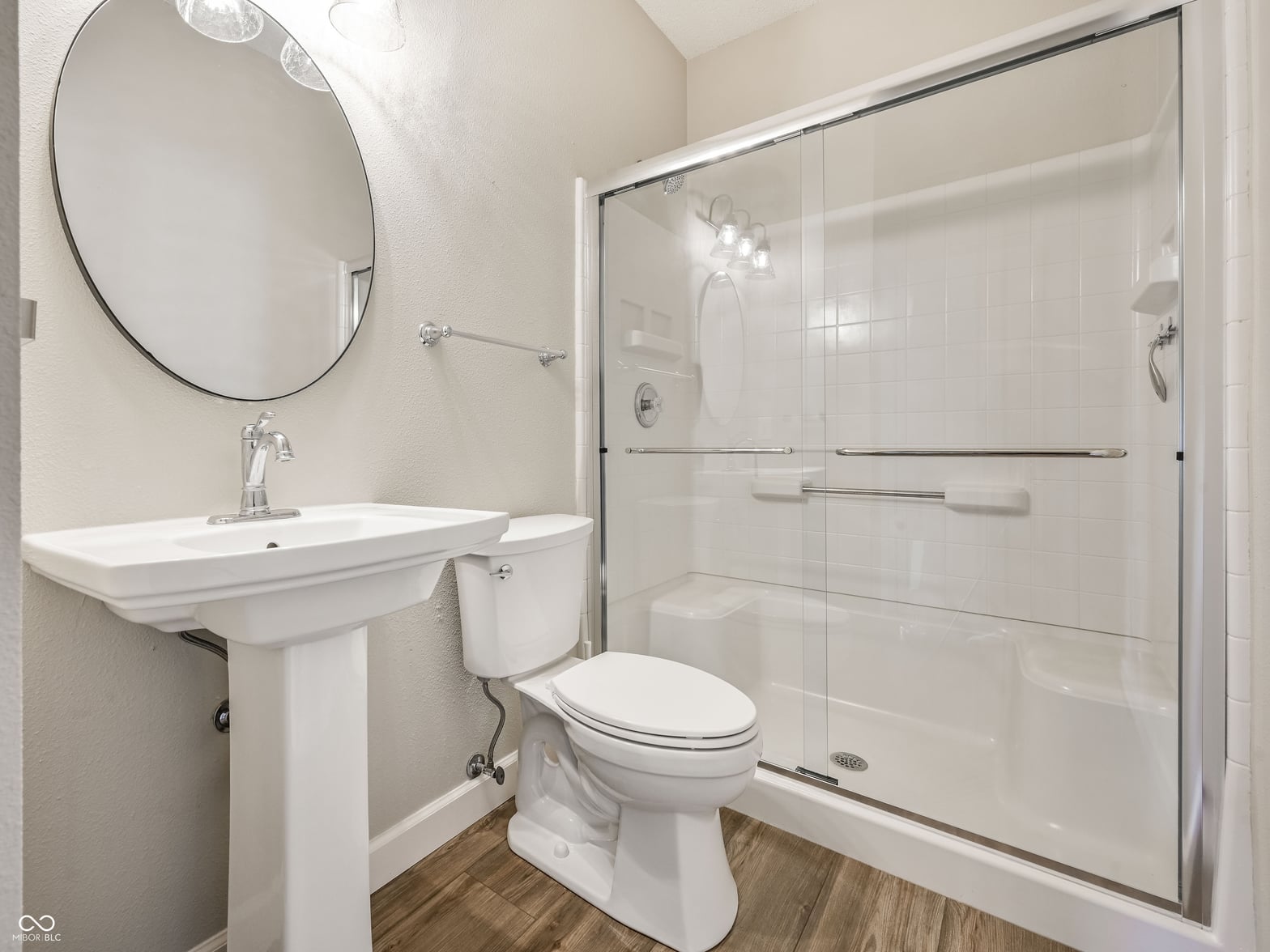 Modern bathroom with spacious walk-in shower and updated fixtures.