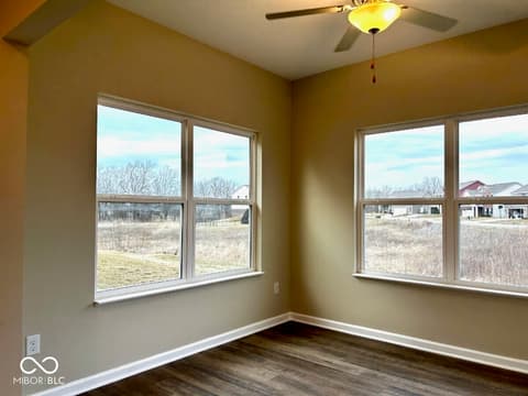 Bonus room at 9789 Mystic Sun Court, Fishers, IN — Bright bonus room with expansive rural views and windows.