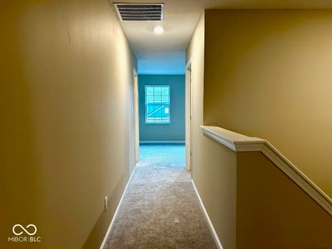 Hallway at 9789 Mystic Sun Court, Fishers, IN — Bright hallway with contemporary finishes and natural light.
