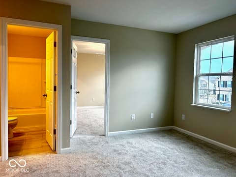 Primary bedroom at 9789 Mystic Sun Court, Fishers, IN