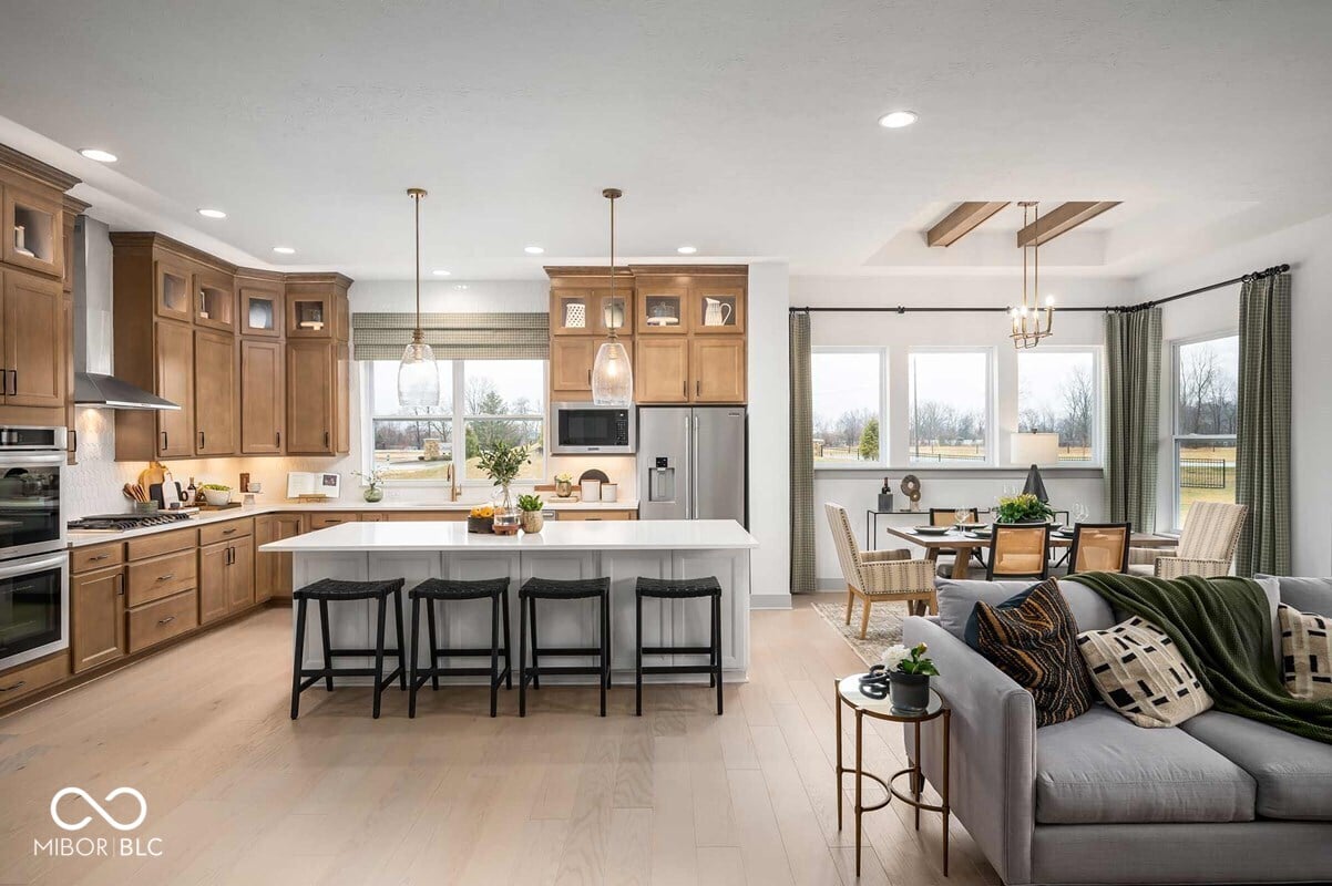 Spacious kitchen with island opening to living areas.