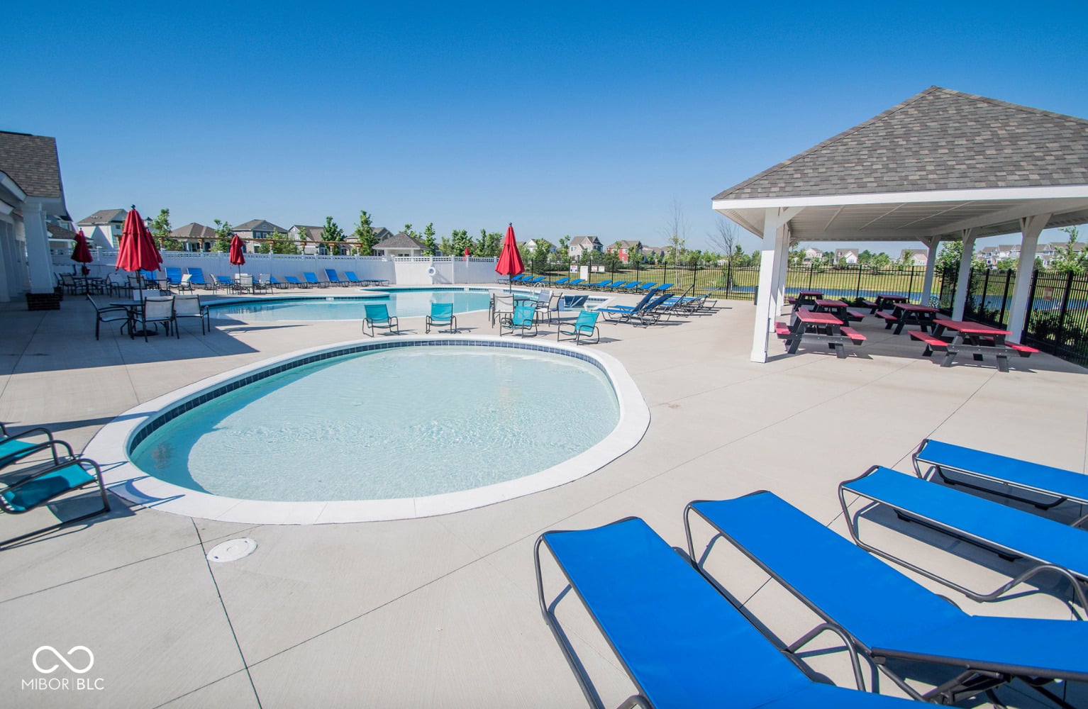 Resort-style pool community with covered pavilion and hot tub.