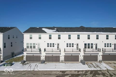 Front exterior at 430 Elite Street, Westfield, IN — Brand new modern townhome community with attached garages.